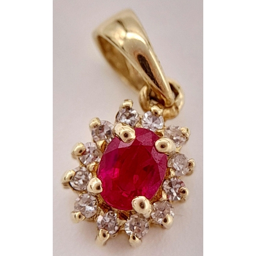 139 - An extremely petite and tasteful DIAMOND and RUBY PENDANT set in 9 CARAT GOLD. Consisting a nice qua... 