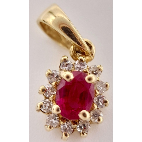 139 - An extremely petite and tasteful DIAMOND and RUBY PENDANT set in 9 CARAT GOLD. Consisting a nice qua... 