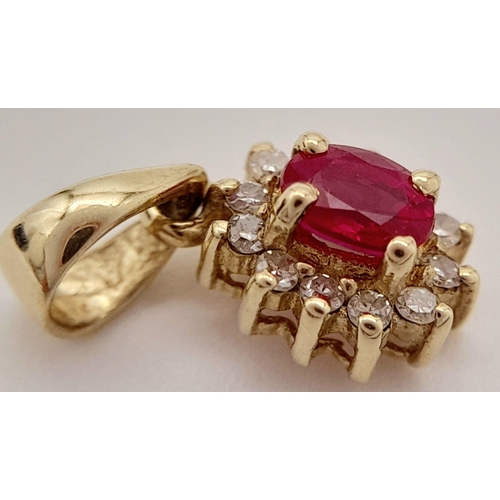 139 - An extremely petite and tasteful DIAMOND and RUBY PENDANT set in 9 CARAT GOLD. Consisting a nice qua... 