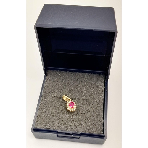 139 - An extremely petite and tasteful DIAMOND and RUBY PENDANT set in 9 CARAT GOLD. Consisting a nice qua... 