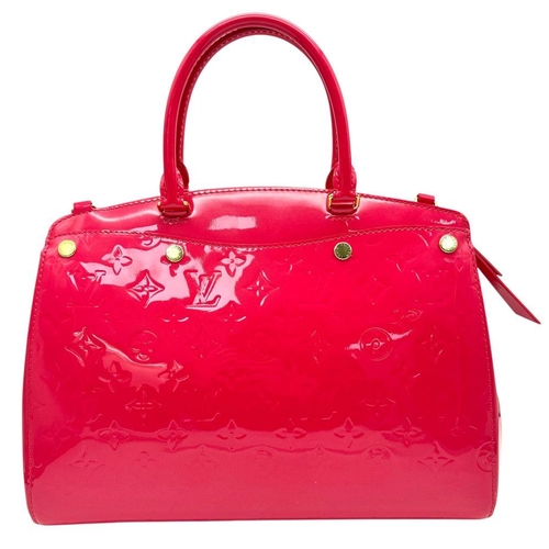 225 - A Louis Vuitton Vernis Brea NM Bag. Pink leather monogram exterior with gold-toned hardware, double ... 