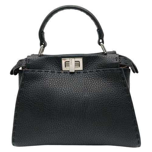 232 - A Fendi Black Mini Peekaboo Bag. Pebbled leather exterior with silver-toned hardware, single leather... 