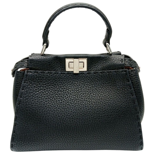 232 - A Fendi Black Mini Peekaboo Bag. Pebbled leather exterior with silver-toned hardware, single leather... 