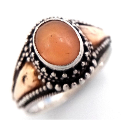 244 - Vintage 18 CARAT GOLD and SILVER RING. Having PEACH MOONSTONE CABOCHON set to top. Complete with rin... 