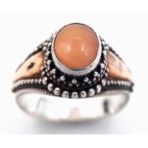 244 - Vintage 18 CARAT GOLD and SILVER RING. Having PEACH MOONSTONE CABOCHON set to top. Complete with rin... 