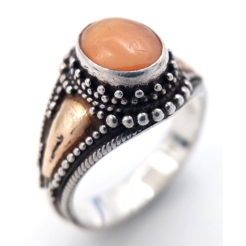 244 - Vintage 18 CARAT GOLD and SILVER RING. Having PEACH MOONSTONE CABOCHON set to top. Complete with rin... 