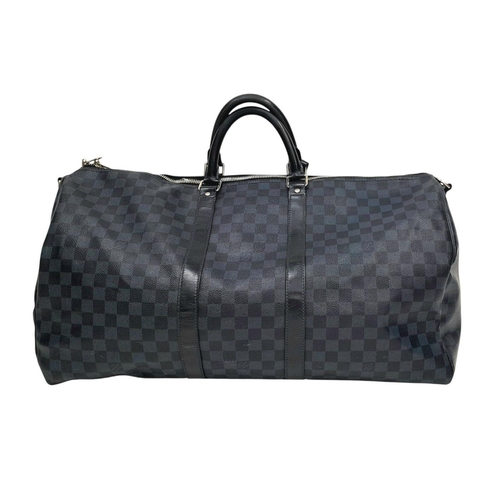 25 - A Louis Vuitton Blue and Black Damier Keepall 55 Bag. Blue and black Damier canvas exterior with bla... 