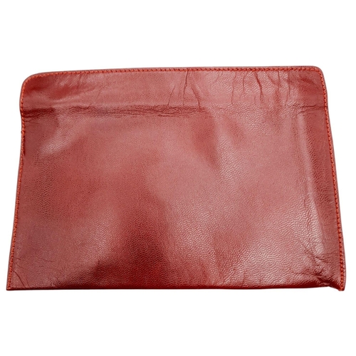 312 - A Cartier Burgundy Must de Cartier Pouch. Leather exterior with gold-toned hardware and a zip closur... 