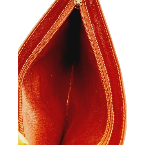 312 - A Cartier Burgundy Must de Cartier Pouch. Leather exterior with gold-toned hardware and a zip closur... 