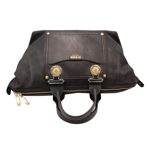 326 - A Versus Versace Leather Shoulder Bag. Black leather exterior with gold-toned hardware. Lion medalli... 