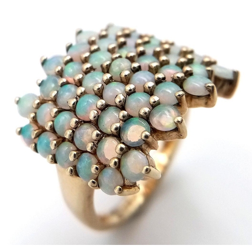 35 - Impressive 9 carat GOLD and OPAL CLUSTER RING. Having 49 x FIRE OPALS Mounted to top. Full UK hallma... 