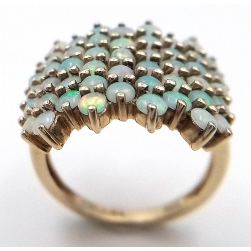 35 - Impressive 9 carat GOLD and OPAL CLUSTER RING. Having 49 x FIRE OPALS Mounted to top. Full UK hallma... 