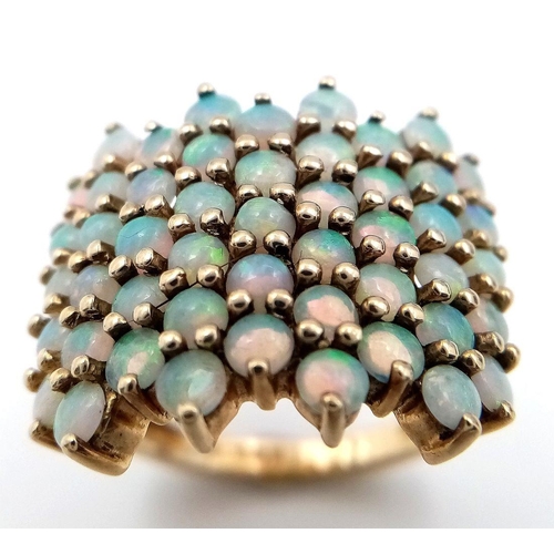 35 - Impressive 9 carat GOLD and OPAL CLUSTER RING. Having 49 x FIRE OPALS Mounted to top. Full UK hallma... 