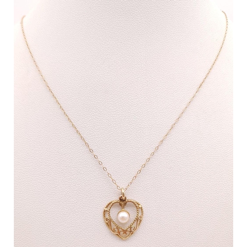 427 - Pretty 9 carat GOLD HEART PENDANT. Having filigree detail with SINGLE PEARL set to centre and mounte... 