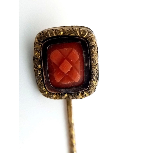 547 - Antique yellow metal TIE STICK PIN with CARVED CORAL FINIAL. 1.2 grams. 5.5 cm.