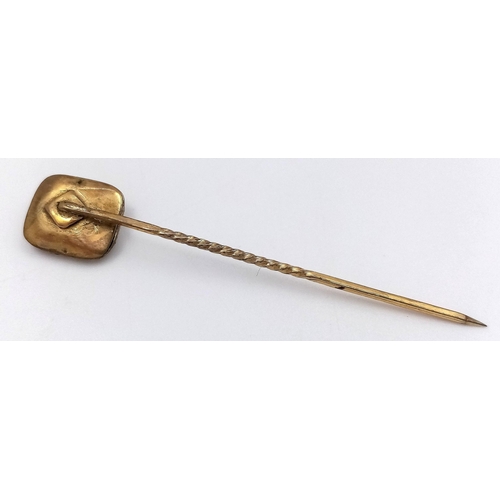 547 - Antique yellow metal TIE STICK PIN with CARVED CORAL FINIAL. 1.2 grams. 5.5 cm.