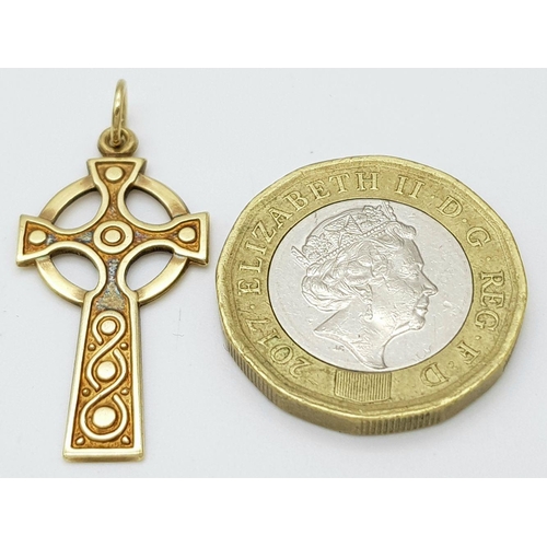 586 - A 9K yellow gold Celtic cross pendant, 1.5g total weight , 31mm x 17mm. Ref SH1724I