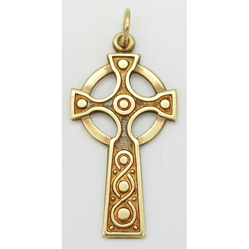 586 - A 9K yellow gold Celtic cross pendant, 1.5g total weight , 31mm x 17mm. Ref SH1724I