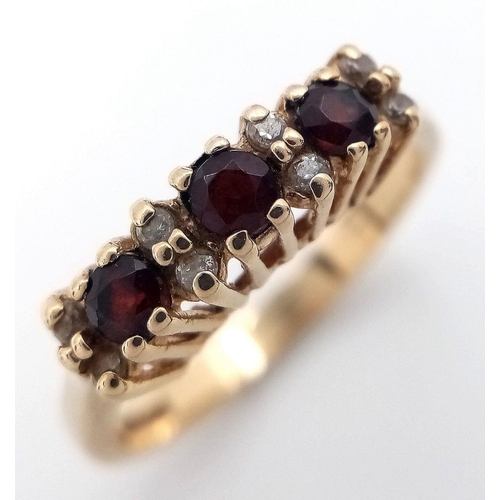 7 - Fabulous 9 carat GOLD, GARNET and DIAMOND TRILOGY RING. Fully hallmarked. Complete with ring box. 2.... 