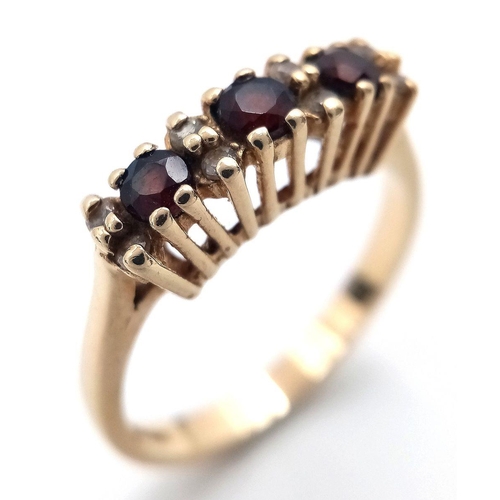 7 - Fabulous 9 carat GOLD, GARNET and DIAMOND TRILOGY RING. Fully hallmarked. Complete with ring box. 2.... 