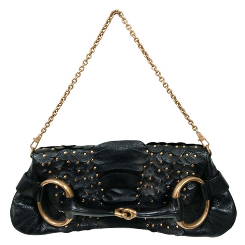 90 - A Gucci Studded Black Leather Shoulder Bag. Black leather exterior with gold toned hardware and stud... 