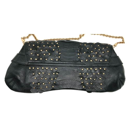 90 - A Gucci Studded Black Leather Shoulder Bag. Black leather exterior with gold toned hardware and stud... 