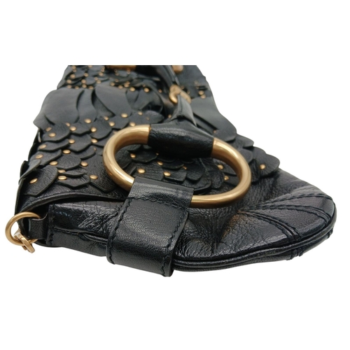 90 - A Gucci Studded Black Leather Shoulder Bag. Black leather exterior with gold toned hardware and stud... 