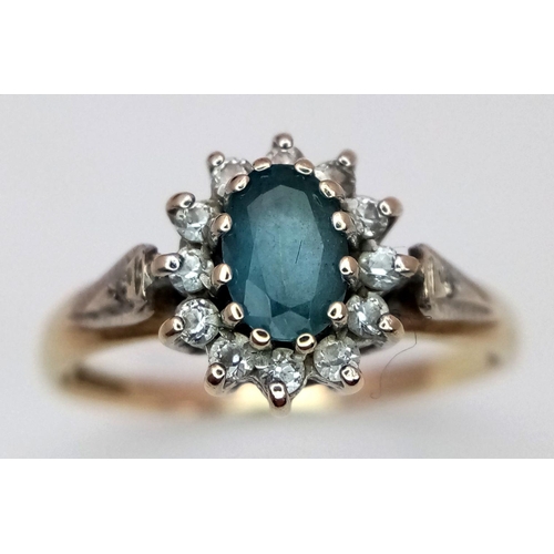 1107 - Beautiful 9 carat GOLD, IOLITE RING. Having an oval cut Blue Iolite set to centre with sparkling Zir... 