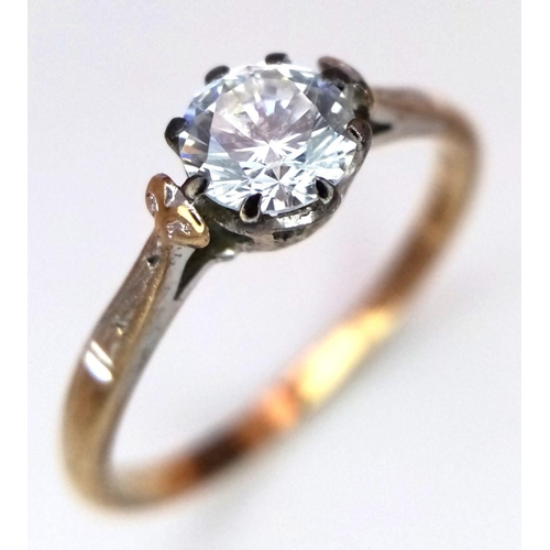 1114 - Impressive vintage 9 carat GOLD, ZIRCONIA SOLITAIRE RING. Having fancy shoulders with a sparkling 0.... 