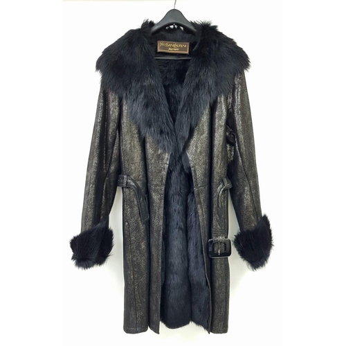 119 - A unique YVES SAINT LAURENT, fur lined, knee length, black “metallic” leather coat with fur collar a... 