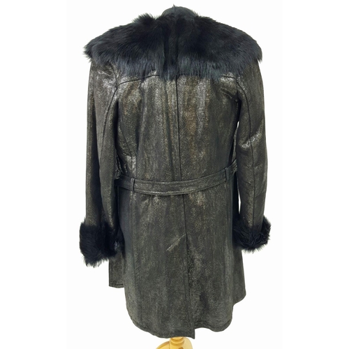 119 - A unique YVES SAINT LAURENT, fur lined, knee length, black “metallic” leather coat with fur collar a... 