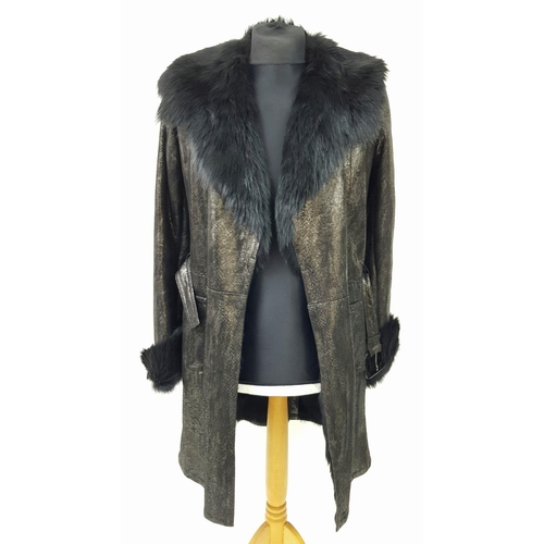 119 - A unique YVES SAINT LAURENT, fur lined, knee length, black “metallic” leather coat with fur collar a... 