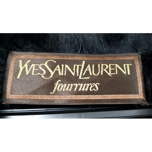 119 - A unique YVES SAINT LAURENT, fur lined, knee length, black “metallic” leather coat with fur collar a... 