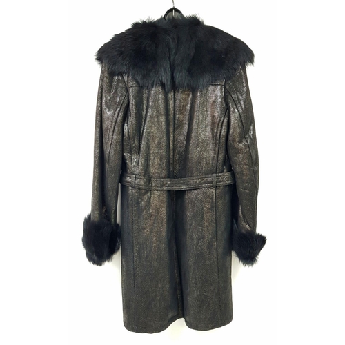 119 - A unique YVES SAINT LAURENT, fur lined, knee length, black “metallic” leather coat with fur collar a... 