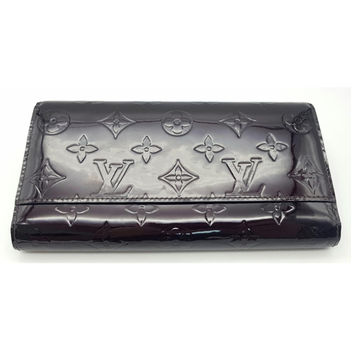 178 - A Louis Vuitton Patent Leather Purse/Wallet. Monogram exterior. Leather interior with zipped and ope... 