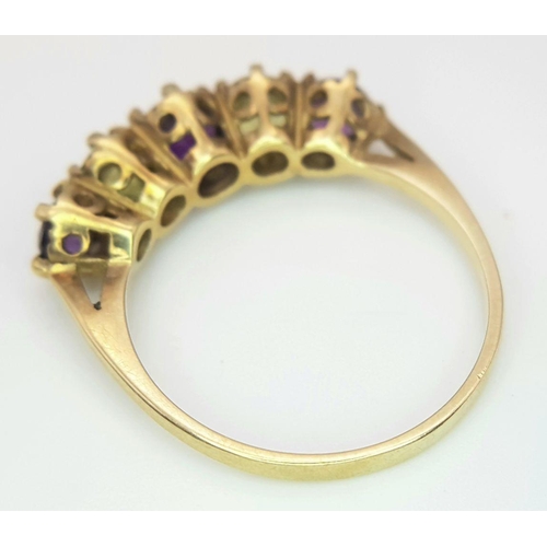 219 - A 9K GOLD RING WITH AMETHYST AND CITRINE STONES .   2.3gms    size N