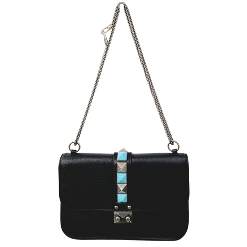 239 - A Valentino Rockstud Black Leather Crossbody Bag. Leather exterior with silver-toned hardware, chain... 