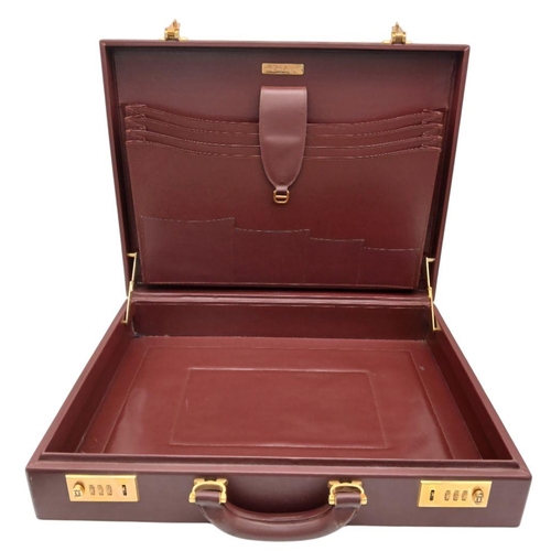 262 - A Must de Cartier Burgundy Leather Briefcase. Burgundy leather exterior with gold-toned hardware. On... 