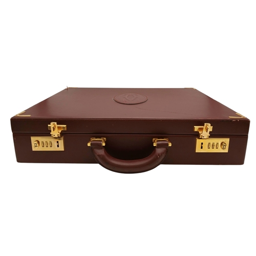 262 - A Must de Cartier Burgundy Leather Briefcase. Burgundy leather exterior with gold-toned hardware. On... 