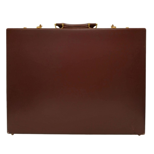 262 - A Must de Cartier Burgundy Leather Briefcase. Burgundy leather exterior with gold-toned hardware. On... 