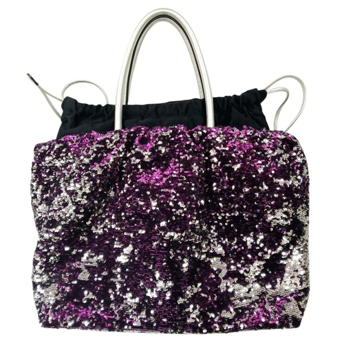 285 - A Dolce & Gabbana Sequin Tote Bag. Silver and purple sequined exterior with leather handles and gold... 