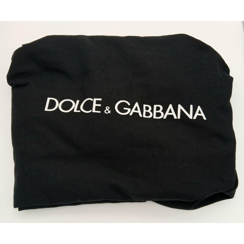 285 - A Dolce & Gabbana Sequin Tote Bag. Silver and purple sequined exterior with leather handles and gold... 