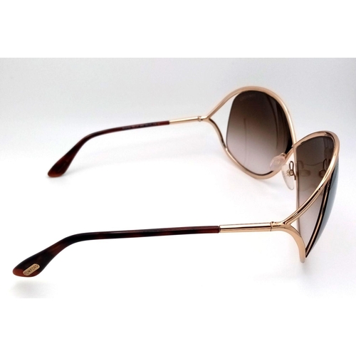 319 - A Pair of Fashionable Tom Ford Ladies Sunglasses. Comes with pouch and case. ref: 18762