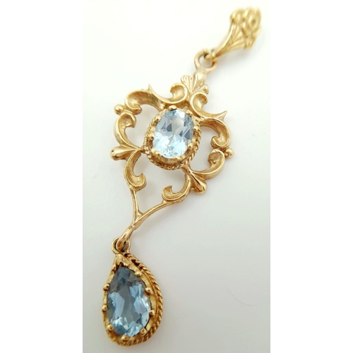 42 - A magnificent large 9 carat GOLD and BLUE TOPAZ PENDANT. Victorian style. Having an exceptional Oval... 