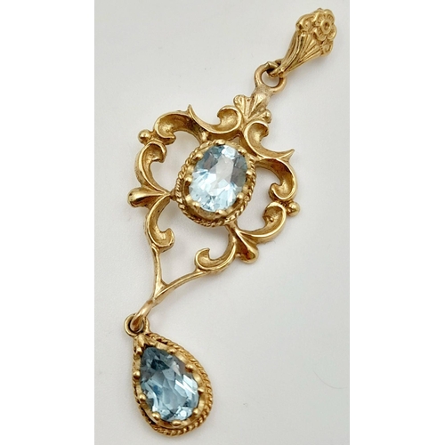 42 - A magnificent large 9 carat GOLD and BLUE TOPAZ PENDANT. Victorian style. Having an exceptional Oval... 