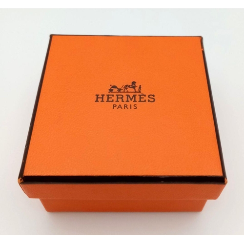 438 - A Hermes Gold Plated Square Scarf Ring. 2cm x 2cm. Comes in original box. ref: STK019615