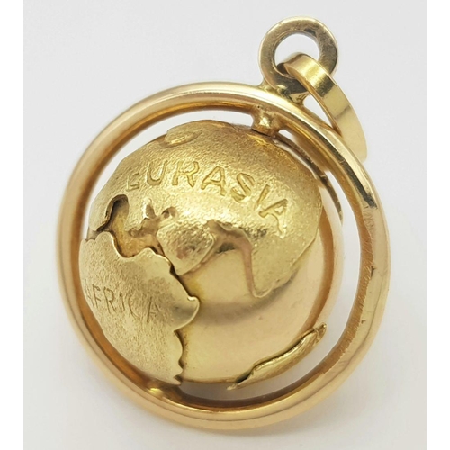 8 - A REALLY UNUSUAL 18K GOLD ROTATING GLOBE PENDANT- THE WORLD IS YOUR OYSTER .      7.2gms