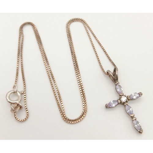 800 - A fancy 925 silver CZ cluster cross pendant on silver chain. Total weight 3.3G. Total length 40cm.