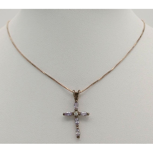 800 - A fancy 925 silver CZ cluster cross pendant on silver chain. Total weight 3.3G. Total length 40cm.