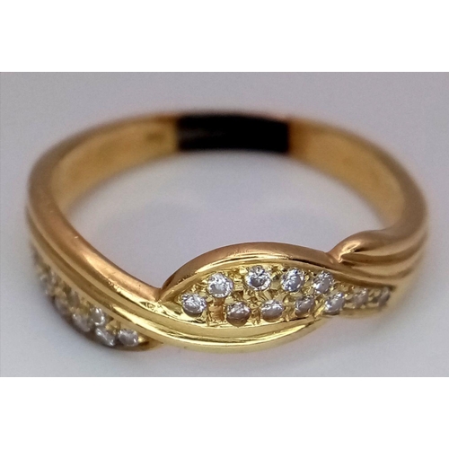 94 - An 18K Gold Diamond Crossover Ring. 22 small round cut diamonds. Size S. 4.2g total weight. ref: STK... 